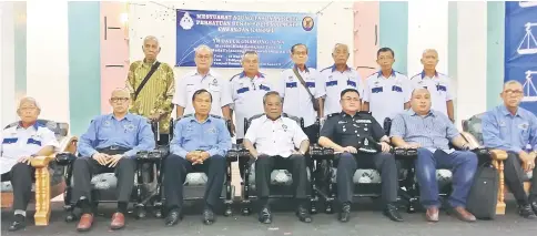  ??  ?? Gramong (seated, centre) and executive members of PBPM Kanowit pose for a photo. From third left are Liew, Daniel and Allan.