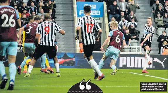  ??  ?? Sean Longstaff scores Newcastle’s second goal against Burnley