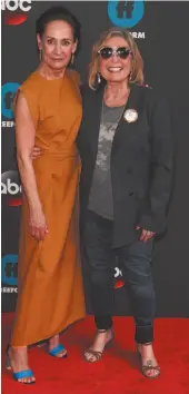  ?? CITIZEN NEWS SERVICE PHOTO ANDY KROPA ?? Laurie Metcalf, left, and Roseanne Barr, attend the Disney/ABC/Freeform 2018 Upfront Party at Tavern on the Green in May in New York. ABC, which canceled its Roseanne revival over its star’s racist tweet, said Thursday, it will air a Conner family...