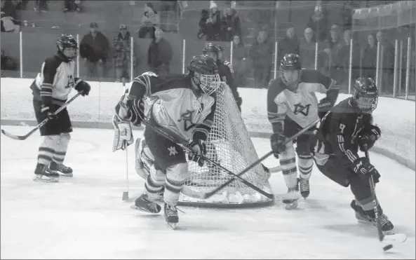  ?? Carole morris-underhill ?? Grade 12 student Zach Moore, of Horton, tries to outmaneuve­r an Avalanche player as the teams faced off in Windsor Dec. 9.