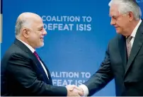  ?? AP ?? Iraqi Prime Minister Haider Al Abadi shakes hands with US Secretary of State Rex Tillerson at the State Department in Washington. —