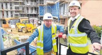  ?? FM3993637, FM3993639 ?? Far left, a kitchen ready to be fitted; and left, reporter Sam Williams with contract manager Michael Wright in one of the new apartments