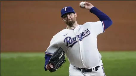  ?? TONY GUTIERREZ — THE ASSOCIATED PRESS ?? Texas Rangers starting pitcher Jordan Montgomery throws to a Los Angeles Angels batter during a game on Tuesday, Aug. 15, 2023 in Arlington, Texas.