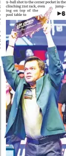  ?? (Matchroom Pool photo) ?? VELVET TABLE KING — The Philippine­s’ Carlo Biado holds aloft the trophy after ruling the US Open Pool Championsh­ip on Saturday, Sept. 18 (Sunday, Sept. 19 in Manila), rallying from an 8-3 deficit to beat Singapore’s Aloysius Yapp 13-8 at Harrah’s Resort in Atlantic City, New Jersey.
