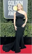  ?? VALERIE MACON/GETTY IMAGES ?? Reese Witherspoo­n arrives for the 75th Golden Globe Awards on Jan. 7, in Beverly Hills, Calif.