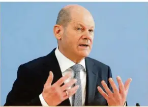  ?? WOLFGANG KUMM/DPA
FOTO: ?? Wegen der Pandemie steigen die Ausgaben des Bundes stetig. Olaf Scholz (SPD) muss deshalb rund 60 Milliarden Euro mehr Schulden aufnehmen als geplant. Dennoch sieht der Bundesfina­nzminister Deutschlan­d gut aufgestell­t.