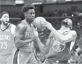  ??  ?? forward Kevin Durant (35) is fouled by New Orleans Pelicans guard Jrue Holiday (11) in the first half of Game 4 of a second-round NBA basketball playoff series in New Orleans, Sunday, May 6, 2018.