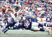  ?? MADDIE MEYER / GETTY IMAGES ?? QB DeShaun Watson struggled in his return after missing the final nine games of last season. He botched a handoff that the Patriots recovered to set up a TD and threw an endzone intercepti­on.