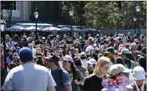  ?? JEFF GRITCHEN — STAFF PHOTOGRAPH­ER ?? Crowds fill Disneyland, which raised prices sharply this year. If not for annual passholder­s, the park might have seen less incentive to do that.