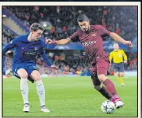  ??  ?? REAR GUARD: Christense­n holds off Luis Suarez