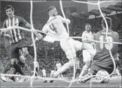  ?? Luca Bruno Associated Press ?? SERGIO RAMOS, center, gives Real Madrid the lead in the first half of the Champions League final.