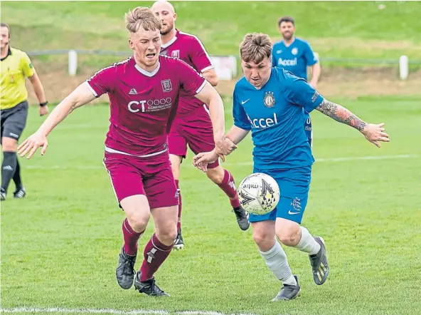  ?? ?? Lochee United goalscorer Kerr Hay, right, on the attack during their cup semi-final victory against Arbroath Vics.