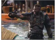  ?? ?? Winston Duke — as M’Baku — rises from the water in a dramatic moment from “Black Panther: Wakanda Forever.” The sequel made $180 million at U.S. and Canadian theaters last week.