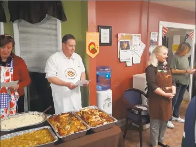  ?? Emily M. Olson / Hearst Connecticu­t Media ?? FISH, Friends In Service to Humanity, held its FISH family Thanksgivi­ng dinner Tuesday night at the shelter at 332 Main St. in Torrington.