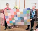  ?? ?? Brenda Spivey and Pam Taylor holding one of the Peggy square blankets.