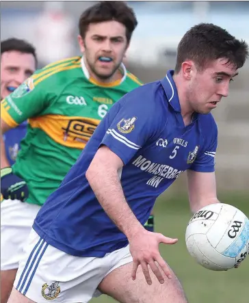  ??  ?? Thomas Sullivan mounts an attack for Naomh Mairtin against Sean O’Mahony’s on Sunday.