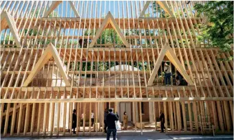  ??  ?? A wooden façade marks the US Pavilion