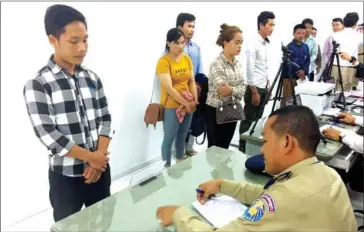  ?? GENERAL DEPARTMENT OF IMMIGRATIO­N ?? People wait to process travel documents at a new passport office in Phnom Penh on Monday. The government opened two more in Battambang and Banteay Meanchey provinces.