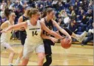  ?? AUSTIN HERTZOG - MEDIANEWS GROUP ?? Pope John Paul II’s Gianna Cagliola, right, fights for possession with Spring-Ford’s Olivia Olsen.