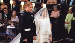  ?? DOMINIC LIPINSKI/AP ?? Markle wore Queen Mary’s diamond bandeau tiara, a platinum-and-diamond headpiece fashioned in 1932 with a brooch that dates to 1893.