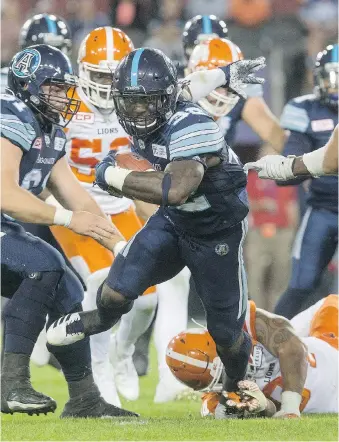  ??  ?? Argonauts running back James Wilder Jr., here breaking a tackle against the Lions, will get his opportunit­y to start in the backfield tonight when Toronto plays host to Ottawa.