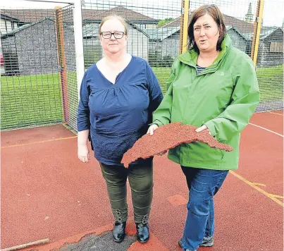  ?? Picture: George McLuskie. ?? Angela High and Joanna Jenkins of Markinch Community Council survey the wreckage after vandalism at the John Dixon Park MUGA.