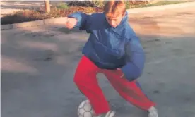  ?? Photograph: Luka Modric’s family collection ?? Luka Modric playing football in the car park of the hotel in Zadar where his family were housed after fleeing their home during Croatia’s war of independen­ce.