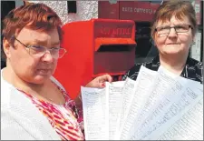  ??  ?? Lorna MacLennan back in 2018 with co-worker Lillian Milne when the village hoped a petition would deliver them a first-class delivery service from Royal Mail.