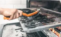  ?? DREAMSTIME ?? Your barbecue’s grates will likely need to be scraped before you cook on them after a long winter of hibernatio­n.