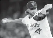  ?? NATHAN DENETTE, THE CANADIAN PRESS FILE PHOTO ?? Toronto Blue Jays starting pitcher Chris Rowley works during first inning against the Tampa Bay Rays last season.