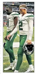  ?? Getty Images ?? WALK OF SHAME: Zach Wilson (right) and Denzel Mims head off the field after the Jets’ loss.