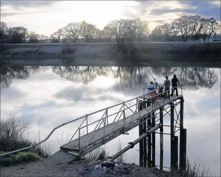  ?? Photograph­s by Rich Pedroncell­i Associated Press ?? ANGLERS fish in the San Joaquin-Sacramento River Delta near Courtland, Calif. Money is the key to WaterFix, a priority of Gov. Jerry Brown that has been in the planning stages for more than a decade. Despite downsizing, the project remains massive.