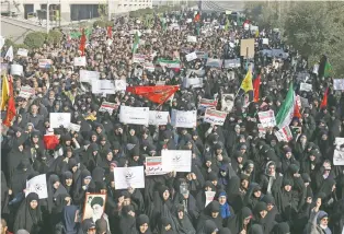  ?? EBRAHIM NOROOZI/THE ASSOCIATED PRESS ?? Iranian protesters chant slogans at a Saturday rally in Tehran, Iran.