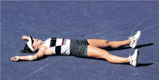  ?? MATTHEW STOCKMAN GETTY IMAGES ?? Bianca Andreescu fought through pain and fatigue to beat Germany’s Angelique Kerber in the final at Indian Wells on Sunday. She’s now ranked 24th in the world.