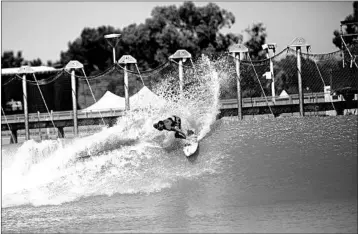  ?? NICK OTTO/WASHINGTON POST ?? A surfer rides the wave during the first day of a world championsh­ip tour at California’s Surf Ranch.