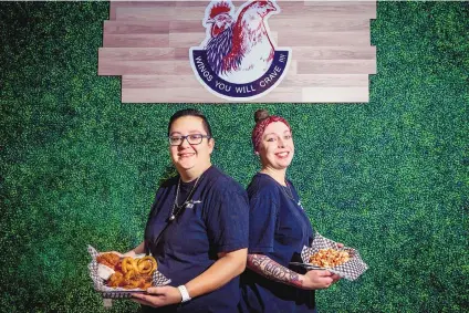  ?? CHANCEY BUSH/JOURNAL ?? Alejandra Leal, left, and Brittany Muller began their chicken-wing business as a food truck and recently opened their first store-front restaurant located on Gold Ave SW and Fourth Street.