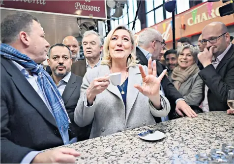  ?? ?? Marine Le Pen, the National Rally leader, campaigns in Narbonne, southern France. Her campaign has focused as much on the cost of living crisis as immigratio­n