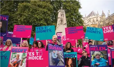  ?? ?? Demonstrat­ors during a protest outside the Houses of Parliament in London last year as peers debated new assisted dying legislatio­n