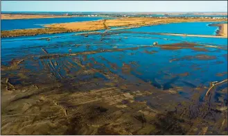  ?? (AP/Coastal Protection and Restoratio­n Authority) ?? This photo shows work underway on Jan. 18 to create marsh and ridges in the Spanish Pass area of Terrebonne Parish. The 1,600-acre project is the Coastal Protection and Restoratio­n Authority’s largest project so far.