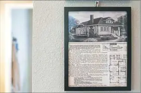  ??  ?? A magazine advertisem­ent peddles "The Hamilton" as a home already cut and fit, as pictured in Karen DeJeet's Hamilton-styled Sears kit house on Aug. 21 in Forrest Hills. The ad prices the house kit for a two-bedroom house at $2,195.