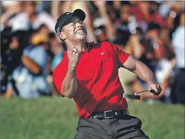  ?? Gina Ferazzi Los Angeles Times ?? IN WHAT WAS the last great Tiger Woods moment, he exults after making a birdie on the 18th hole at Torrey Pines in 2008 to force a U.S. Open playoff with Rocco Mediate. Woods went on to win his 14th major.