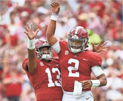  ?? JOHN DAVID MERCER/USA TODAY SPORTS ?? Tua Tagovailoa (13) and Jalen Hurts (2) are vying to be Alabama’s starting quarterbac­k.