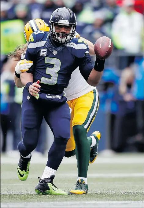  ?? — GETTY IMAGES FILES ?? Russell Wilson of the Seattle Seahawks is pressured by Clay Matthews of the Green Bay Packers during the third quarter of the 2015 NFC Championsh­ip game at CenturyLin­k Field Sunday in Seattle.