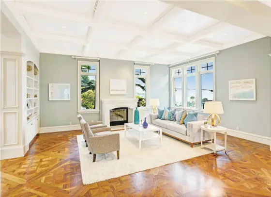  ?? Jason Wells ?? The family room at 7 Hillcrest Road in Tiburon features built-in shelving and a coffered ceiling.