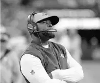  ?? BILL KOSTROUN/AP ?? Dolphins coach Brian Flores watches during the second half against the New York Jets on Sunday in East Rutherford, N.J.