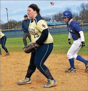  ?? ANNE NEBORAK — DIGITAL FIRST MEDIA ?? Erin Bevec of Great Valley takes a lead off first base as Sun Valley first baseman Bridget Thomas looks on during Friday’s Ches-Mont League American Division game.