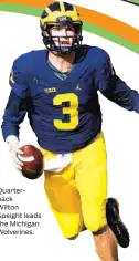  ??  ?? Quarterbac­k Wilton Speight leads the Michigan Wolverines.