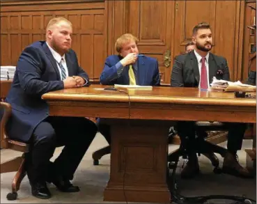  ?? TRACEY READ — THE NEWS-HERALD ?? Justin Green, left, admits his role in an attempted Madison Township drive-by shooting Nov. 6 in Lake County Common Pleas Court. He appeared in court for the Feb. 20 incident with defense attorneys Robert Biales, middle, and Tomas Tatarunas, right.