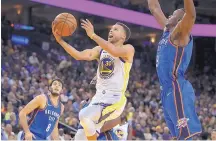  ?? BEN MARGOT/ASSOCIATED PRESS ?? Golden State’s Stephen Curry (30) scored 32 points as the Warriors beat Oklahoma City Tuesday to open the season.