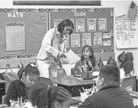  ?? OLIVER TOURON/AFP VIA GETTY IMAGES ?? Teacher Alexxa Martinez works in her classroom in Nevitt Elementary School, in Phoenix, Arizona, on Oct. 26, 2022.